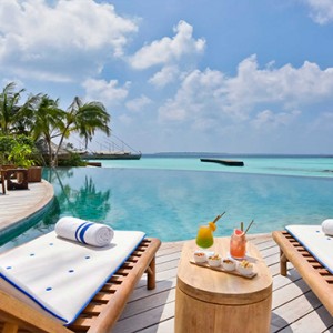 Milaidhoo Island Maldives - Luxury Maldives Honeymoon Packages - pool loungers