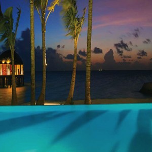 Ozen by Atmosphere at Maadhoo Island - Luxury Maldives Honeymoon Packages - Joie de vivre pool at night