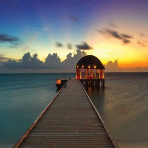 Ozen by Atmosphere at Maadhoo Island - Luxury Maldives Honeymoon Packages - Ozen arrival pavillion at sunset