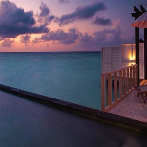 Ozen by Atmosphere at Maadhoo Island - Luxury Maldives Honeymoon Packages - Wind villa with pool exterior pool at night