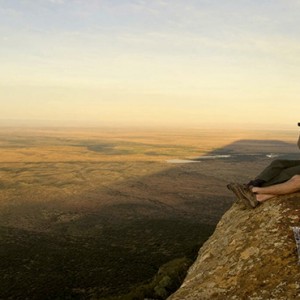 Samara Private Game Reserve - Luxury South Africa Honeymoon Packages - Couple looking out and picnic