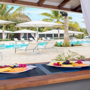 Serenity at Coconut Bay - Luxury St lucia Honeymoon Packages - dining by pool