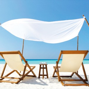 Velassaru Maldives - Luxury Maldives Honeymoon Packages - Relaxing on the beach