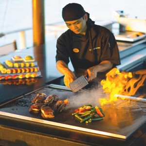 Velassaru Maldives - Luxury Maldives Honeymoon Packages - Teppanyaki chef making food