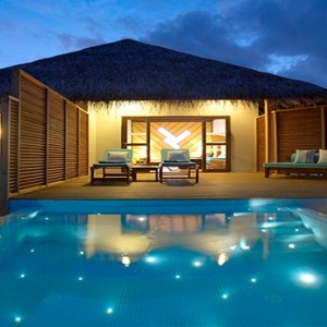 Velassaru Maldives - Luxury Maldives Honeymoon Packages - Water Bungalow with Pool exterior at night