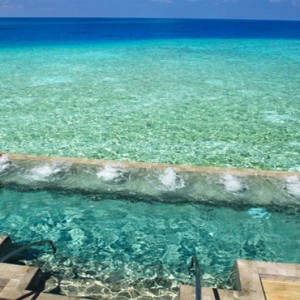 Velassaru Maldives - Luxury Maldives Honeymoon Packages - aerial view of villa pool