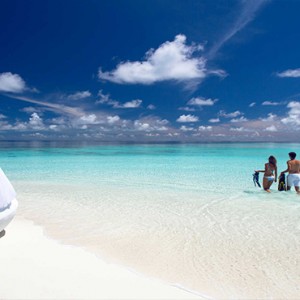 Velassaru Maldives - Luxury Maldives Honeymoon Packages - couple on beach