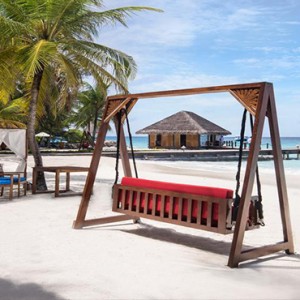 Vivanta By Taj - Coral Reef - Luxury Maldives Honeymoon Packages - hammock chair on beach