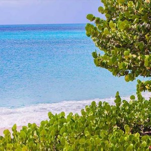 Keyonna Beach - Luxury Antigua Honeymoon Packages - Cozy dining table on restaurant deck