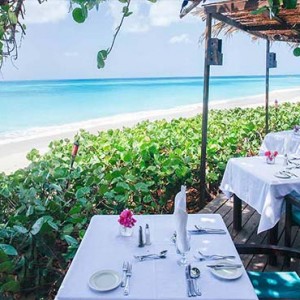 Keyonna Beach - Luxury Antigua Honeymoon Packages - dining setup at our Al fresco beachfront restaurant