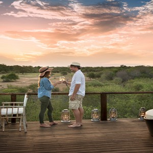 Lion Sands Game Reserve - Luxury South Africa Honeymoon Packages - Chalkley treehouse couple drinking