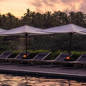 Bali Honeymoon Packages Alila Ubud Pool Sun Loungers At Sunset