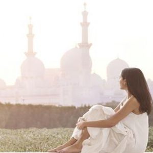 Women On Balcony The Ritz Carlton Abu Dhabi, Grand Canal Abu Dhabi Honeymoon Packages