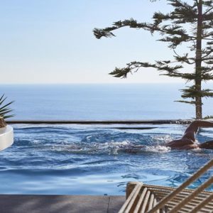 Greece Honeymoon Packages Myconian Utopia Man Swimming In Pool