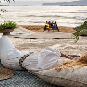 Greece Honeymoon Packages Domes Noruz Chania Woman Relaxing On Beach