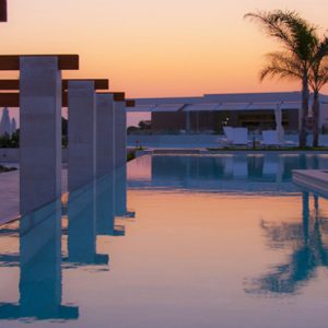 Greece Honeymoon Packages Avra Imperial Pool At Sunset