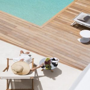 Greece Honeymoon Packages Kensho Ornos Woman Relaxing By Pool