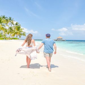 Maldives Honeymoon Packages Reethi Faru Resort Couple On Beach