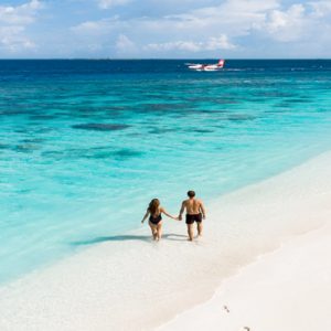 Maldives Honeymoon Packages Reethi Faru Resort Couple On Beach1