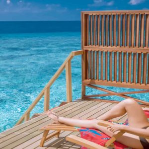 Maldives Honeymoon Packages Women Relaxing In Water Villa