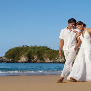 Mexico Honeymoon Packages Secrets Huatulco Resorts & Spa Couple On Beach Wedding