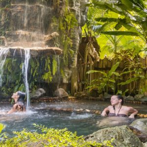 Phuket Honeymoon Packages TreeHouse Villas Couple Under Waterfall