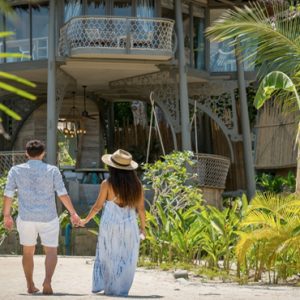 Phuket Honeymoon Packages TreeHouse Villas Couple Walking Outside Villa