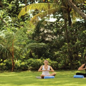 Bali Honeymoon Packages Padma Resort Legian Couple Doing Yoga In Garden