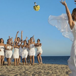 Mexico Honeymoon Packages Secrets Puerto Los Cabos Golf & Spa Resort Bride Throwing Bouquet