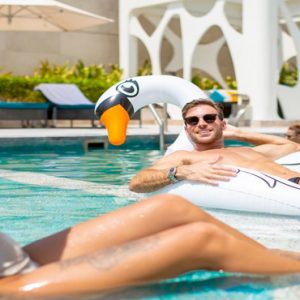 Couple In A Pool V Hotel Dubai, Curio Collection By Hilton Dubai Honeymoons