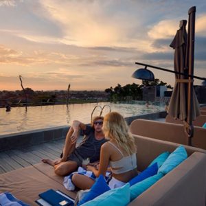 Couple Relaxing By Rooftop Pool De Vins Sky Hotel Seminyak Bali Honeymoons