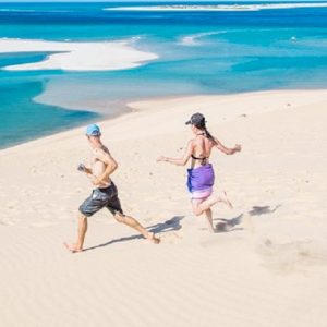 Couple Running On Beach Azura Benguerra Island Mozambique Honeymoons