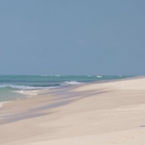 Couple Strolling On Beach Azura Benguerra Island Mozambique Honeymoons