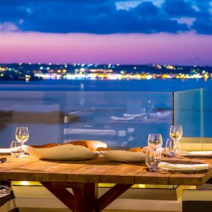 Dining With A View At Night Abaton Island Resort & Spa Greece Honeymoons