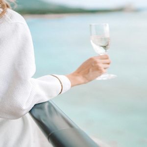 Woman Drinking Champagne Outrigger Waikiki Beach Resort Hawaii Honeymoons