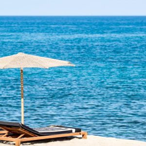 Beach With Sun Loungers Abaton Island Resort & Spa Greece Honeymoons