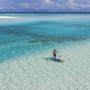 Couple Paddle Boarding Pullman Maldives Maamutaa Resort Maldives Honeymoon