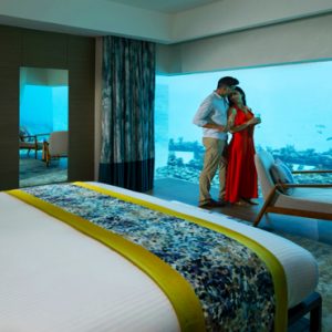 The Aqua Villas Couple In Underwater Bedroom Pullman Maldives Maamutaa Resort Maldives Honeymoon